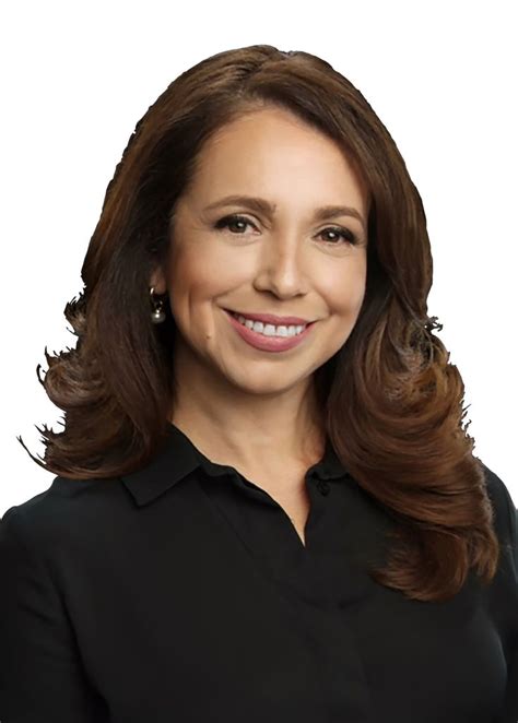 woman  long brown hair wearing  black shirt  smiling   camera  standing
