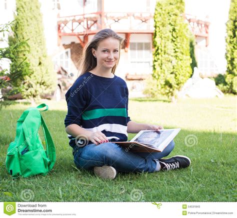 beautiful school  college girl sitting   grass  books