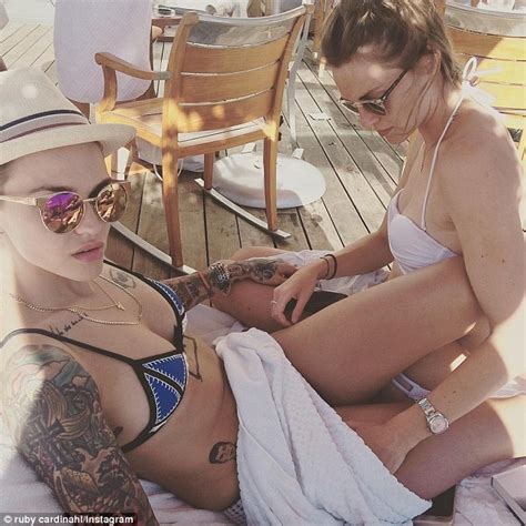orange is the new black s ruby rose displays her tattooed physique at pool party daily mail online