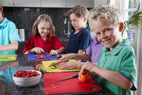 children preparing food stock photo dissolve