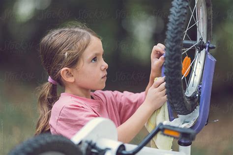 girl fixing her bike pordejan ristovski