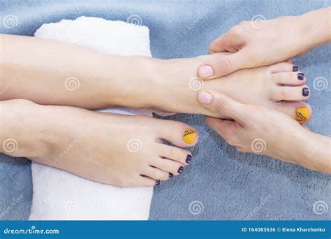 foot massage  spa salon closeup foot massage relax skin stock photo