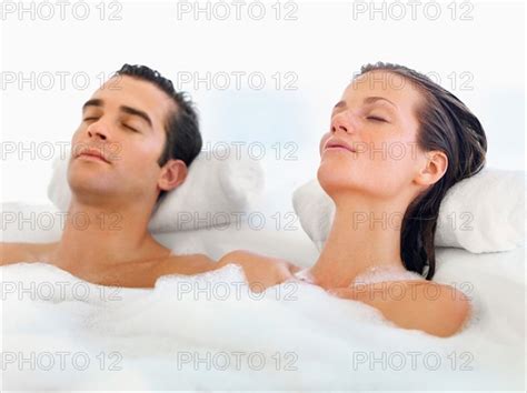 Couple Relaxing In Bathtub Photo12 Tetra Images