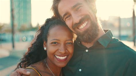 Closeup Portrait Of Happy Interracial Couple In The Port Backlighting