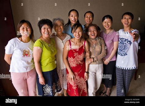 group of nine asian oriental chinese women standing facing camera