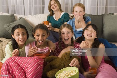 Woman And Group Of Preteen Girls Watching Tv Bildbanksbilder Getty Images