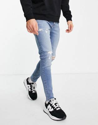 asos design superskinny jeans met powerstretch en scheuren op kniehoogte  middenblauwe
