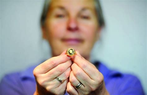 Kathy Anderson Of Paw Paw Holds A Ring She Found While Metal Detecting
