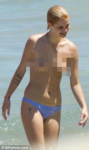 a topless pixie geldof frolics in the sea with nick