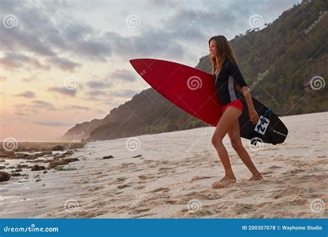 Horizontal Shot Of Active Young Girl With Perfect Body Shape Prepares