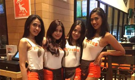 hooters promises servers will dress more modestly while restaurant