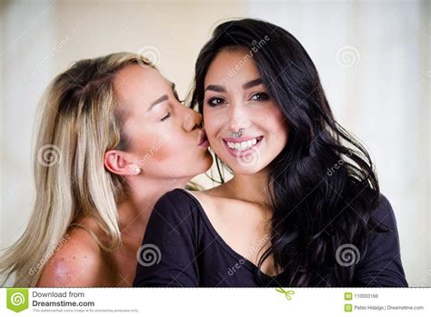 Close Up Of A Lesbians Lovers In A Room At Morning Blonde Kissing A