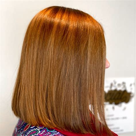 dimensional auburn  goldwell hair color  interlocks salon spa