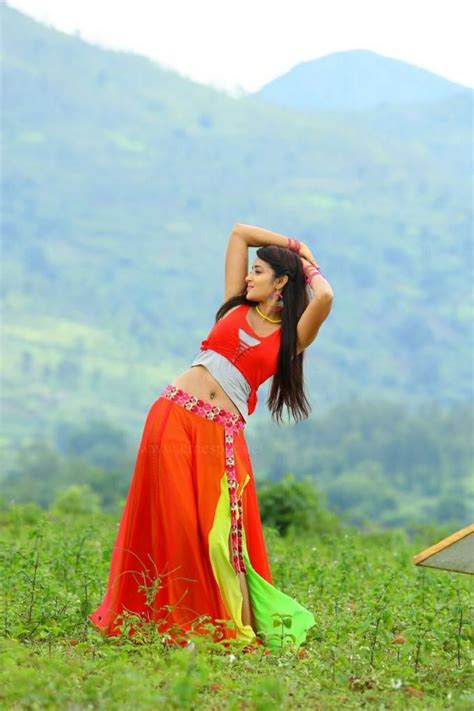 indian model bhanu sree navel hip show in orange lehenga choli saree