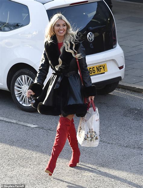 christine mcguinness puts on a racy display in thigh high red boots and