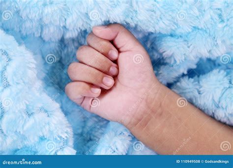 close    newborn baby boys hand stock photo image  human concepts