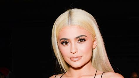 kylie jenner wears white holiday dress with feathers teen vogue