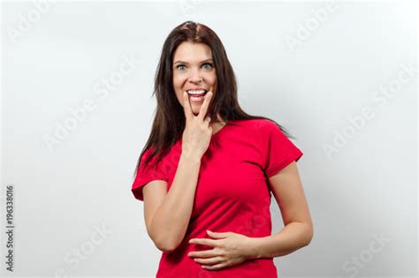 Young Beautiful Girl Showing A Gesture Tongue Between Free Download