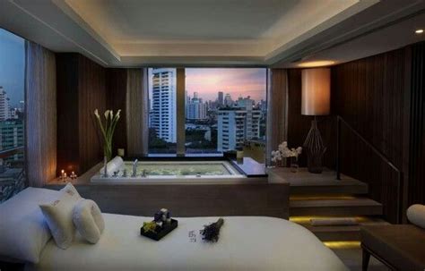 bedroom   large jacuzzi tub    window overlooking  city