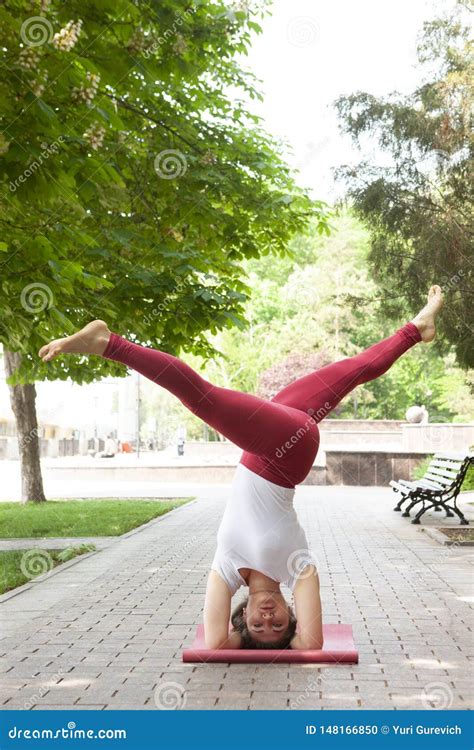 holiday woman  yoga pose meditation   public park sport healthy concept stock photo
