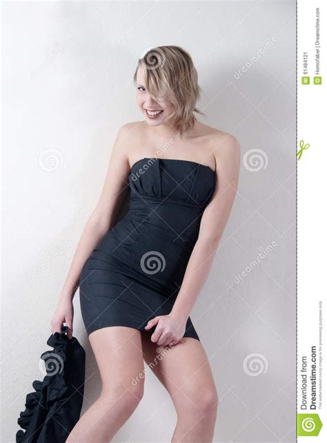 Indoor Shoot Of A Model In A Black Dress Stock Image