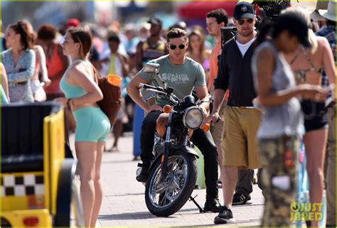 Zac Efron Shows His Muscles On A Motorcycle For Baywatch