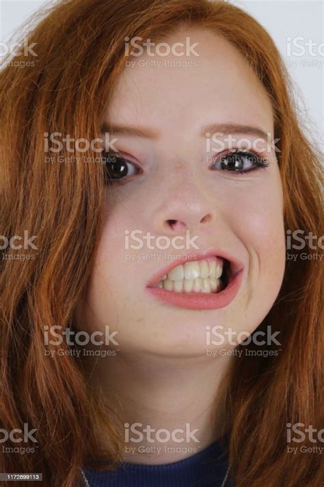 closeup image of teenage girl 14 15 with pale skin and freckles natural