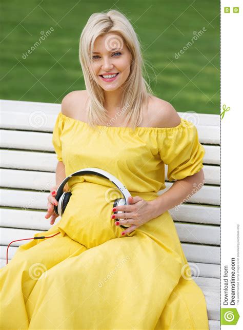 beautiful and pregnant blonde girl in a yellow dress stock image image of funny mother 77537771