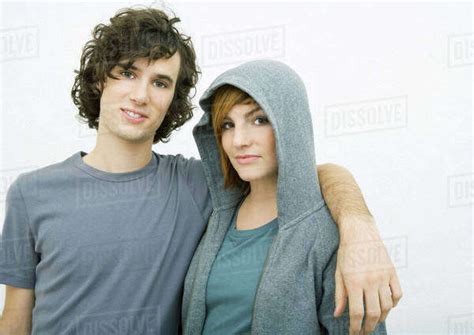 young couple man  arm  womans shoulders portrait stock photo dissolve