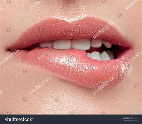 woman lips mouth biting lip stock photo  shutterstock