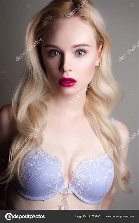 beauty model girl with perfect make up red lips and blue