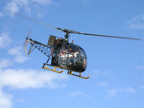 tami holman helicopter background
