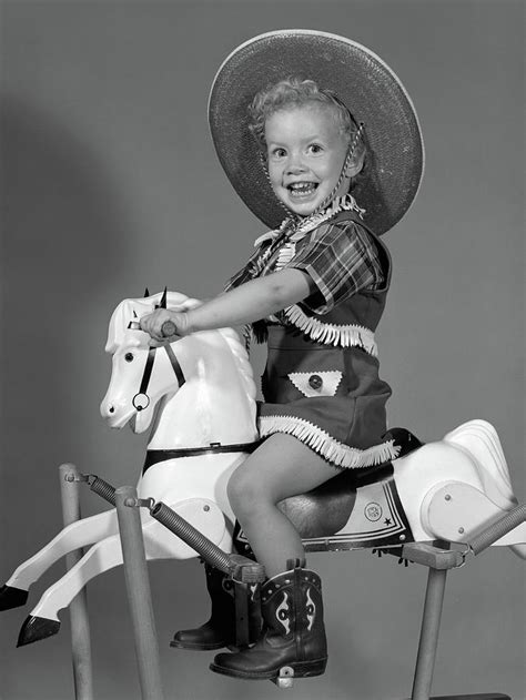 1950s Girl Dressed As Cowgirl Riding Photograph By Vintage Images
