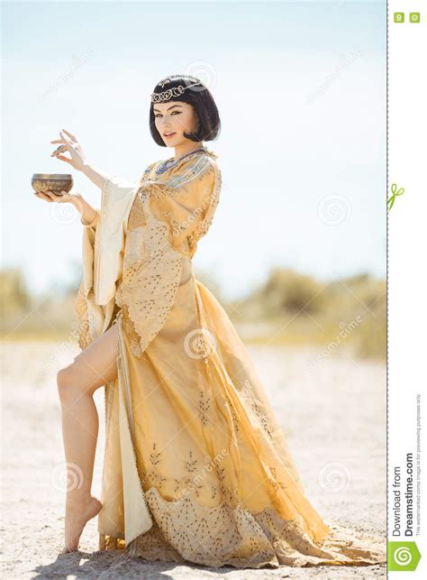 Beautiful Woman Like Egyptian Queen Cleopatra With Cup