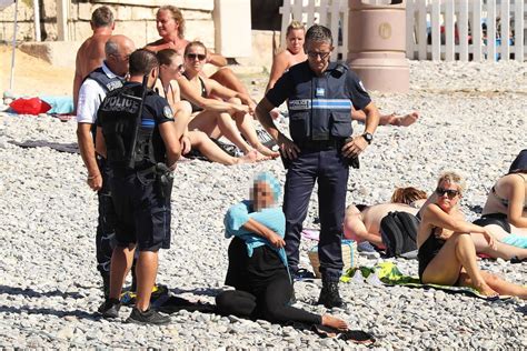 burkini clad woman forced to disrobe on french beach
