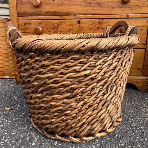 sold  large  purpose woven wicker basket  wood handles