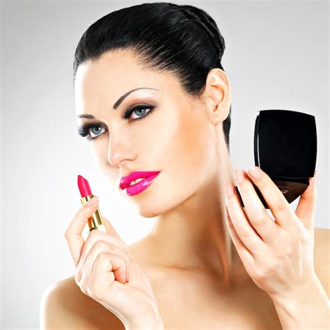 Free Photo Beautiful Woman Makes Makeup Applying Pink Lipstick On Lips