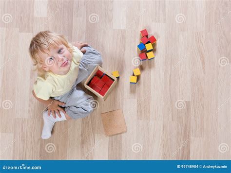 kid playing  toys  floor top view stock photo image  colorful