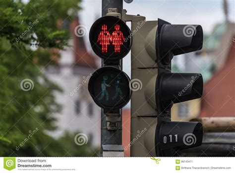 red traffic light with a same sex couple symbol stock