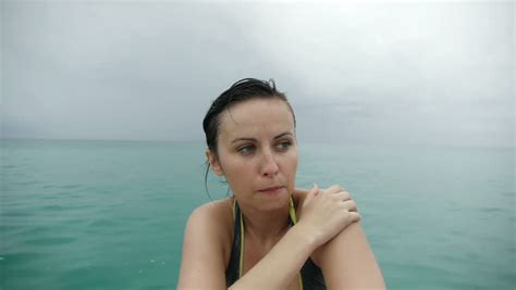 beautiful brunette girl enjoying her vacation and a warm summer rain stock footage video 2789980
