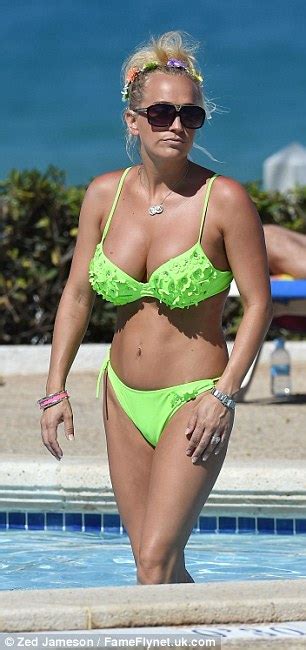 Leah Wright Sunbathes In Neon Green Bikini Before