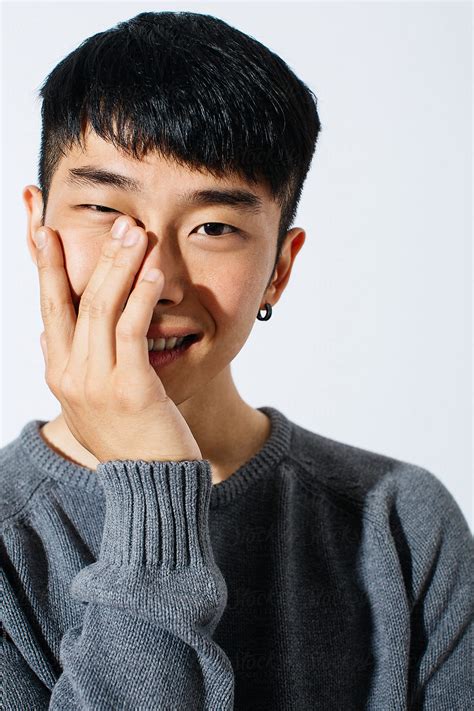 portrait   young asian man smiling  white background