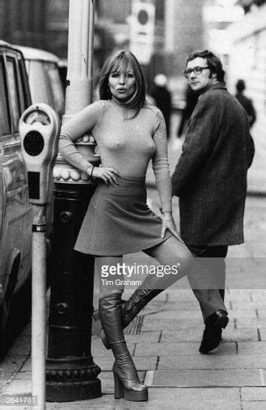 susan shaw models a mini skirt and platform boots news photo getty images