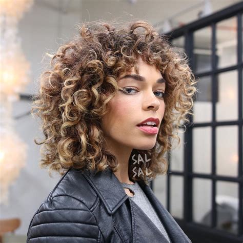 shaggy curly fro  bangs  brunette ombre color  latest