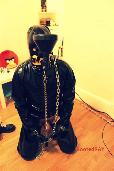 Red Bondage Rubber Slave In Training Bootedray