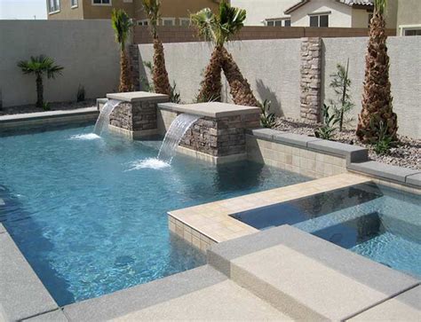 custom pool  raised spa  stacked stone spillway artistic pool