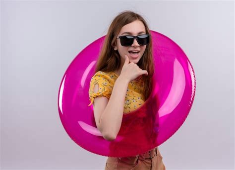 Free Photo Joyful Young Girl Wearing Sunglasses And Swim Ring Putting