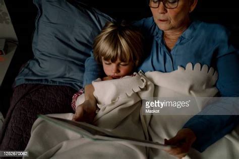 Grandmother Reading To Grandson Photos And Premium High Res Pictures