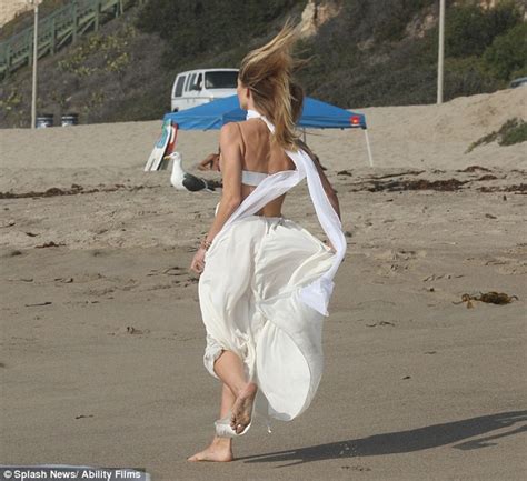 rosie huntington whiteley flashes stunning figure at beach