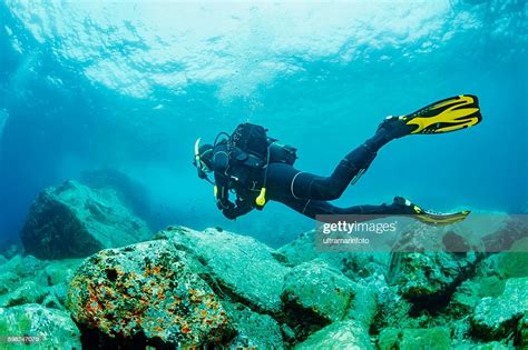 Scuba Diving Underwater Scuba Diver In Blue Lagoon Photo Getty Images